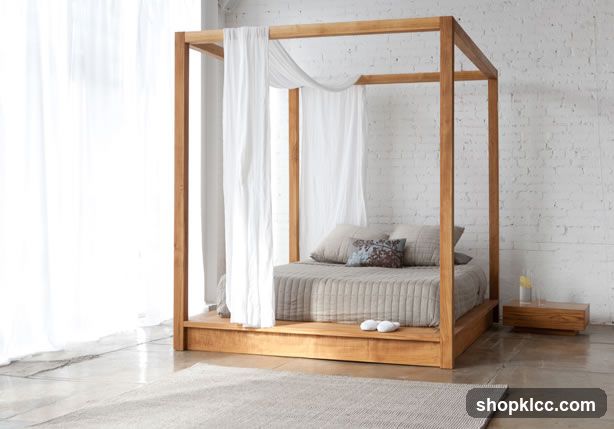 Four-poster bed with white curtains