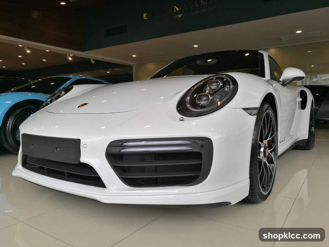White Porsche in showroom