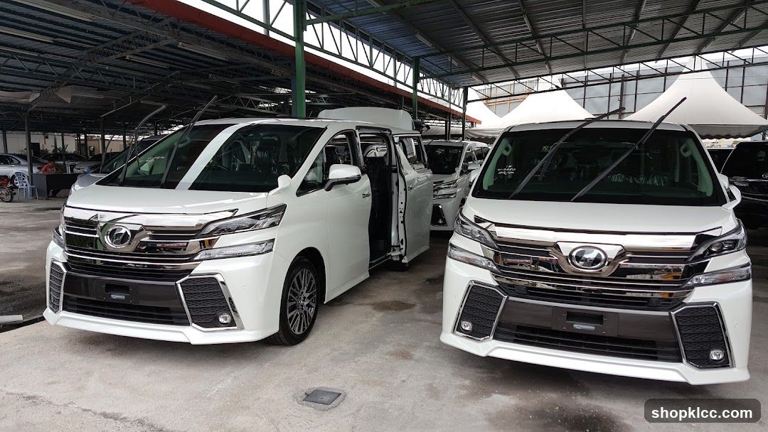 White Toyota Alphard and Vellfire in a car showroom