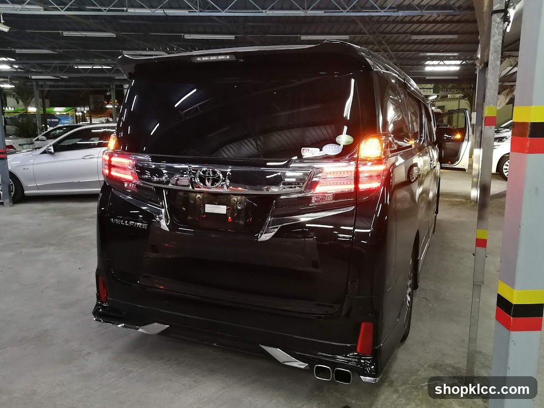 Black Toyota Alphard Rear View in Parking Garage