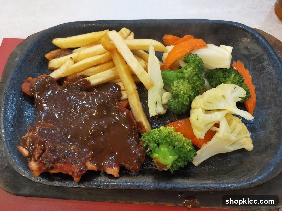 Sizzling Steak with Fries and Vegetables