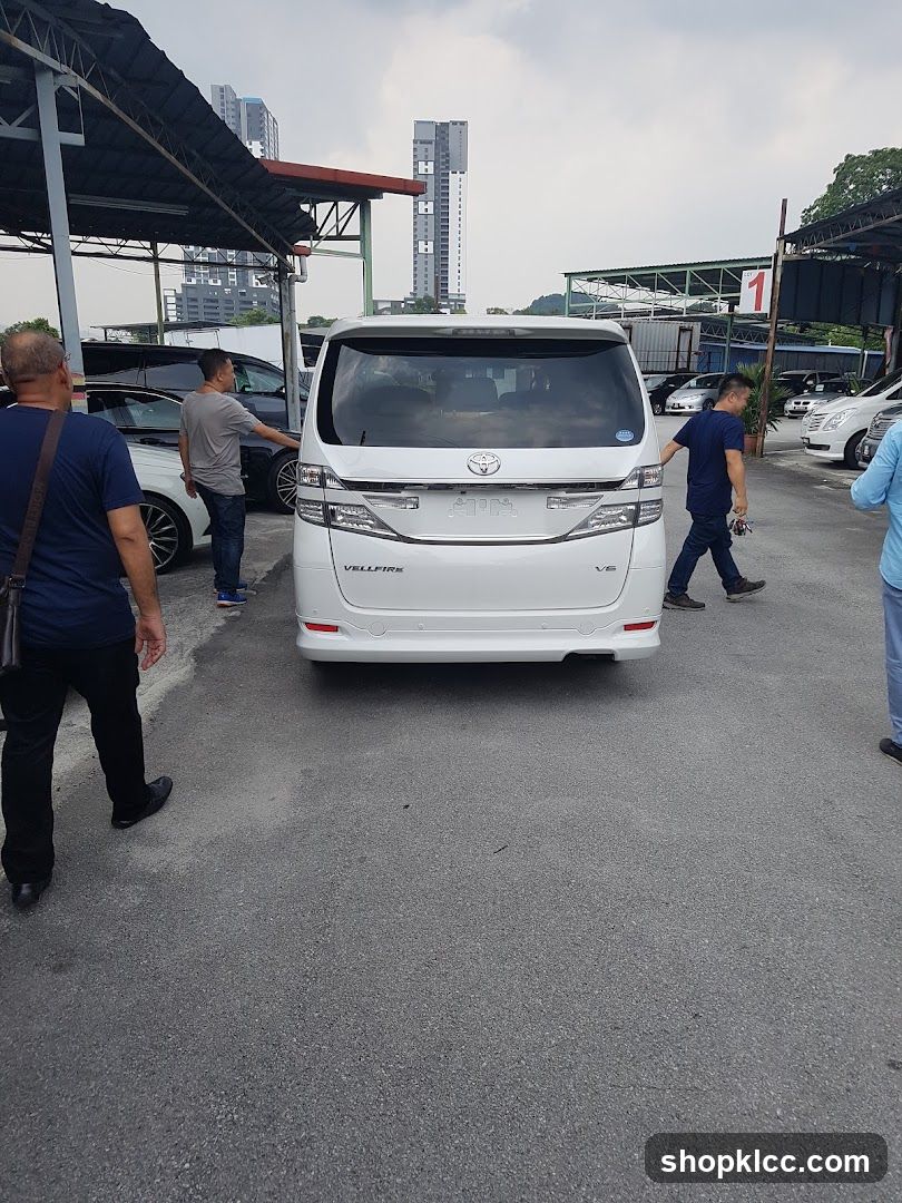 White Toyota Vellfire in parking lot