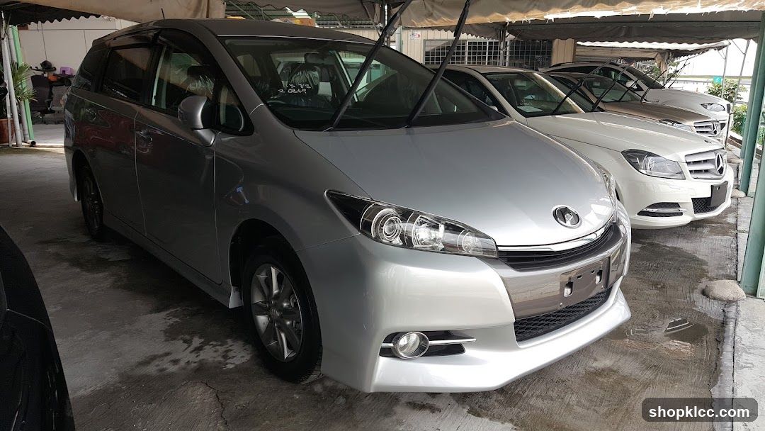 Silver Toyota Estima parked under carport