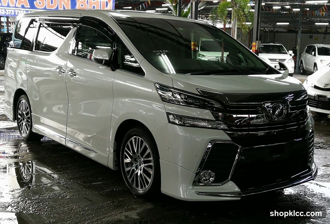 White Toyota Alphard in a showroom