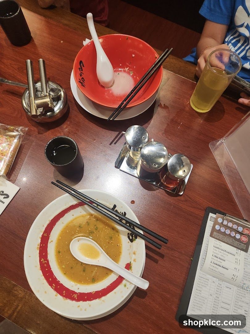 Table with Ramen Bowls and Menu