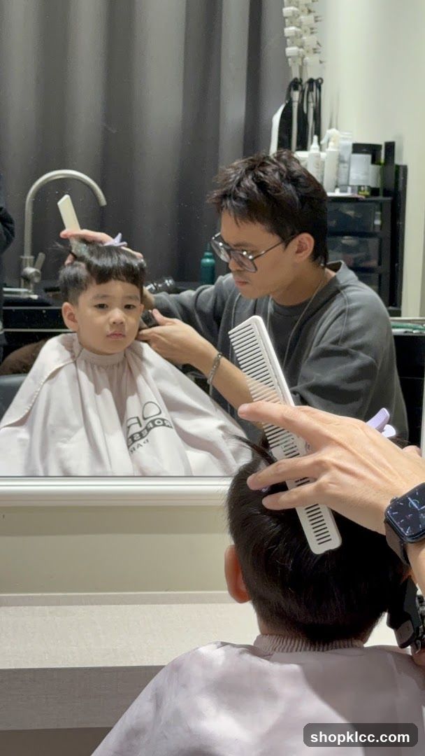 Barber cutting a child's hair