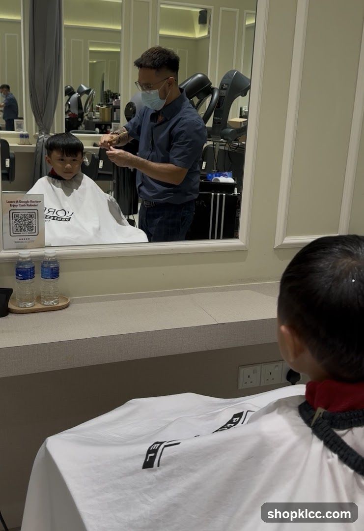 Barber cutting a child's hair