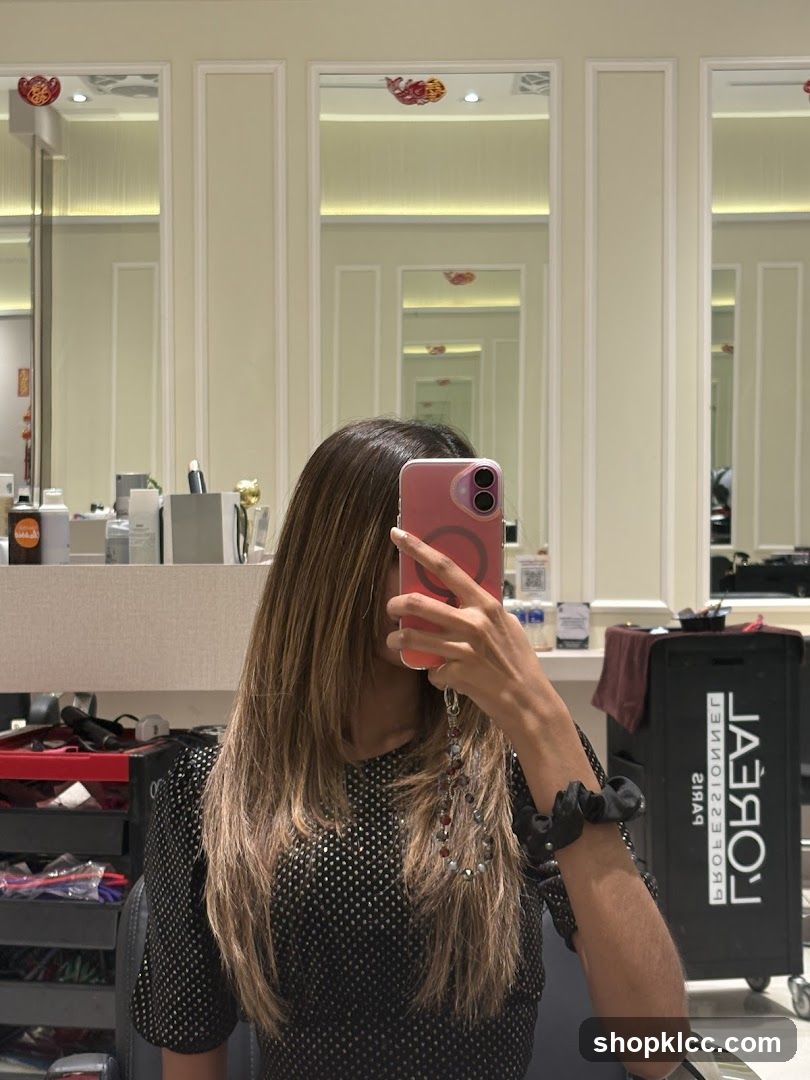 Woman taking a selfie in a salon