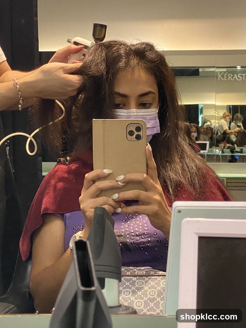 Woman getting hair styled