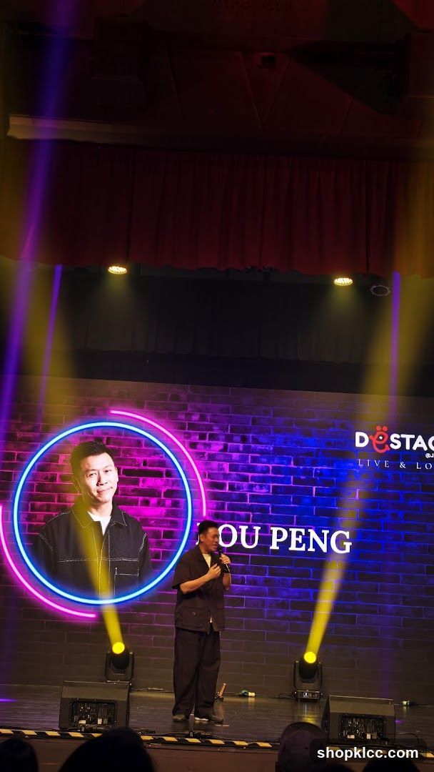 Stage Performance with Neon Backdrop