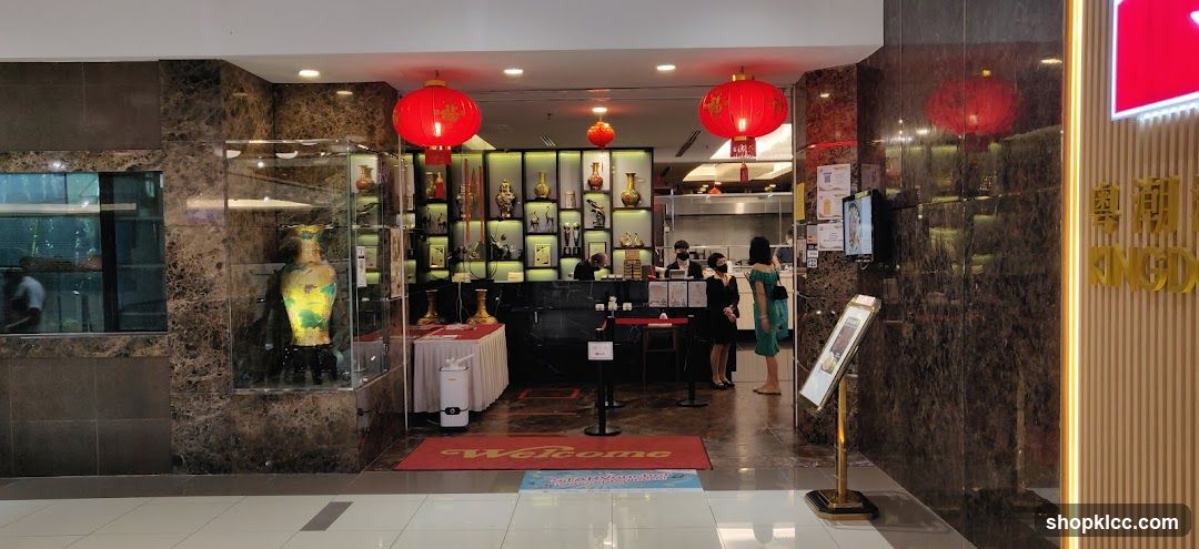 Restaurant Interior with Decorative Vases and Staff