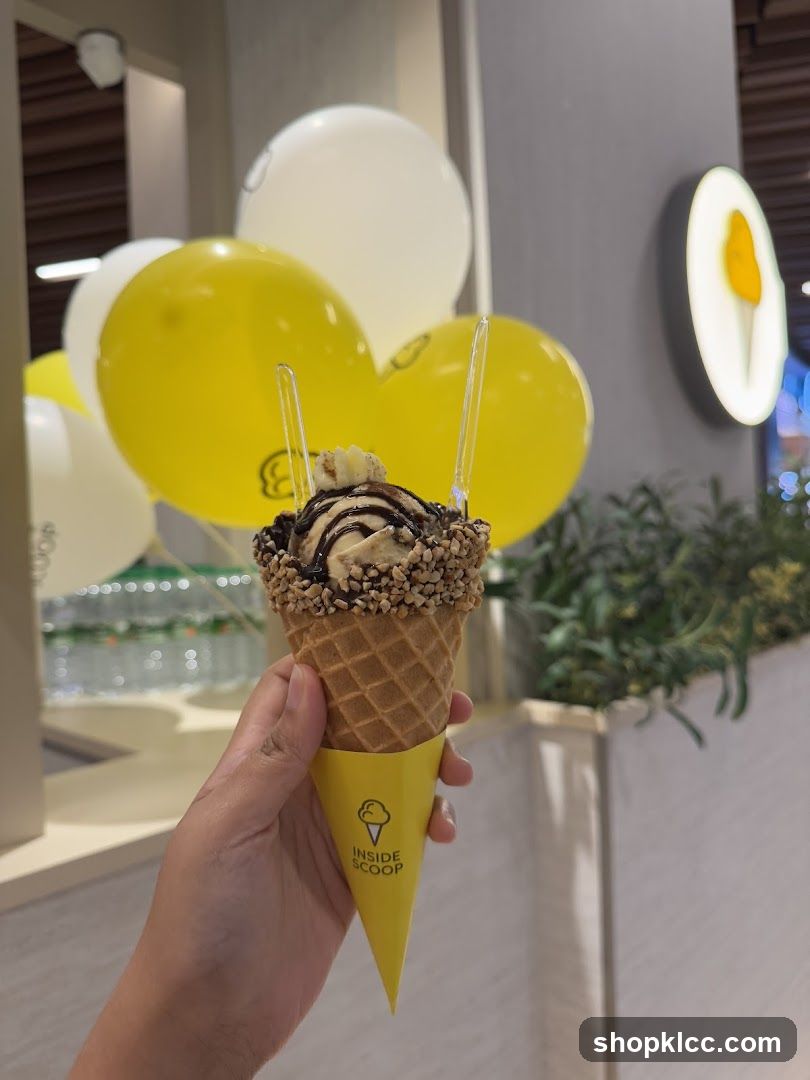 Ice cream cone with balloons