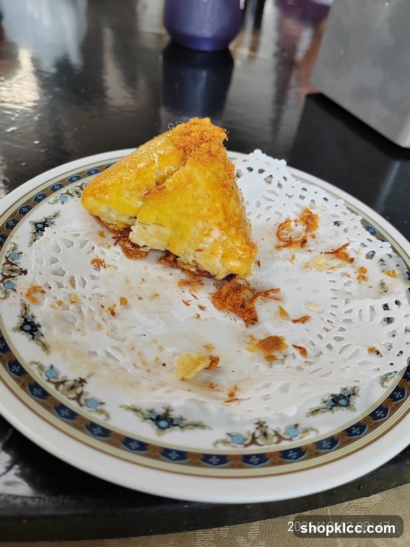 Eating a piece of fried food