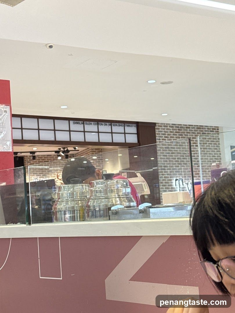 Interior of a shop with staff and equipment