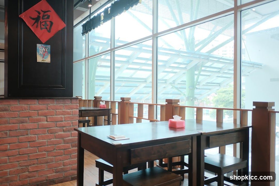 Restaurant Interior with Brick Wall and Large Windows
