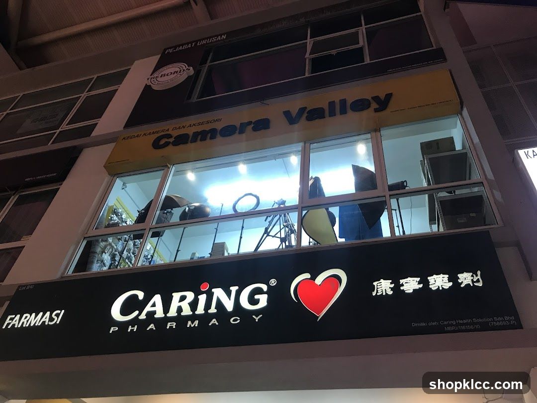 Camera Valley and Caring Pharmacy Storefront