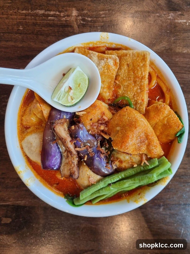 Spicy Noodle Dish with Lime Wedge