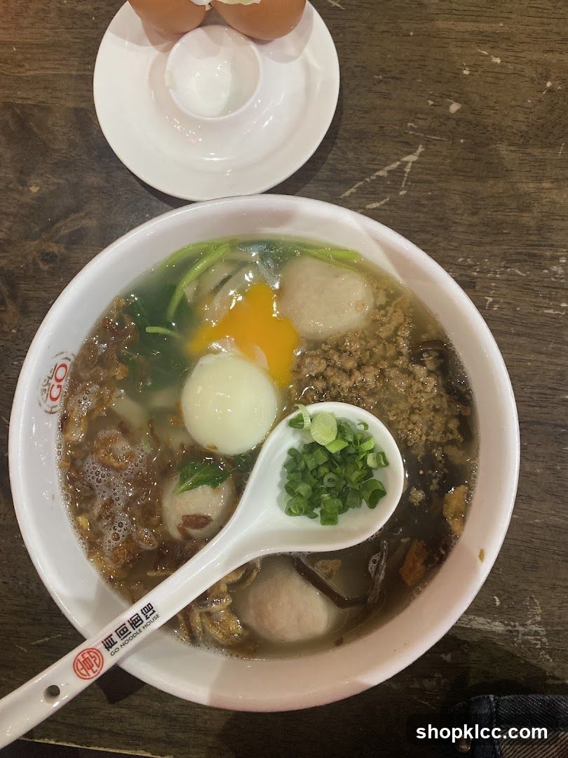 Bowl of Soup with Egg and Meatballs