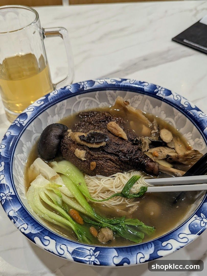 Bowl of Noodle Soup with Meat and Vegetables