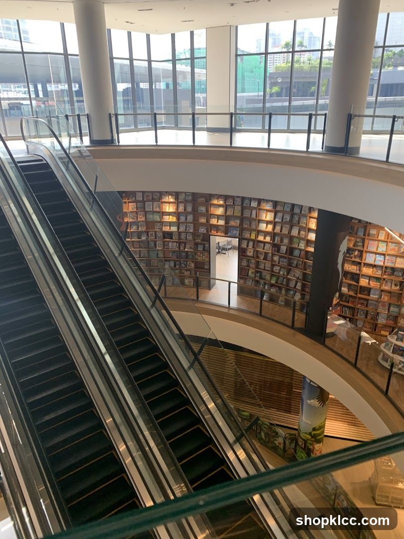 Interior of a modern bookstore or library with escalators and bookshelves