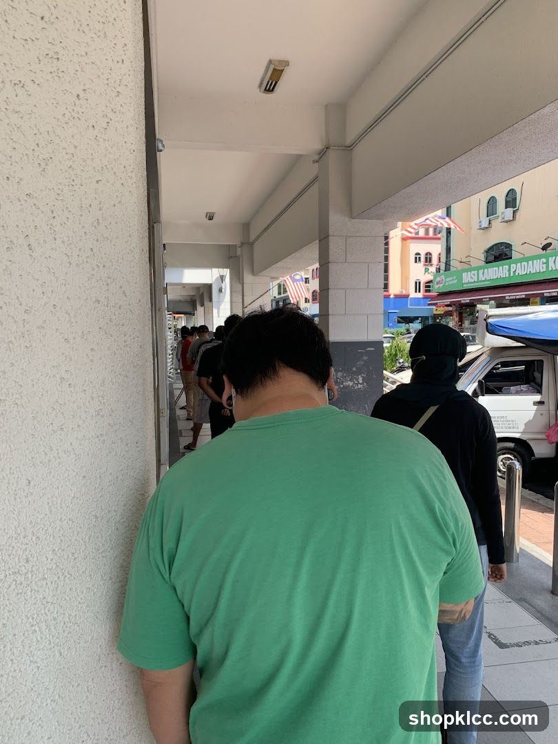 People waiting in line outside a building