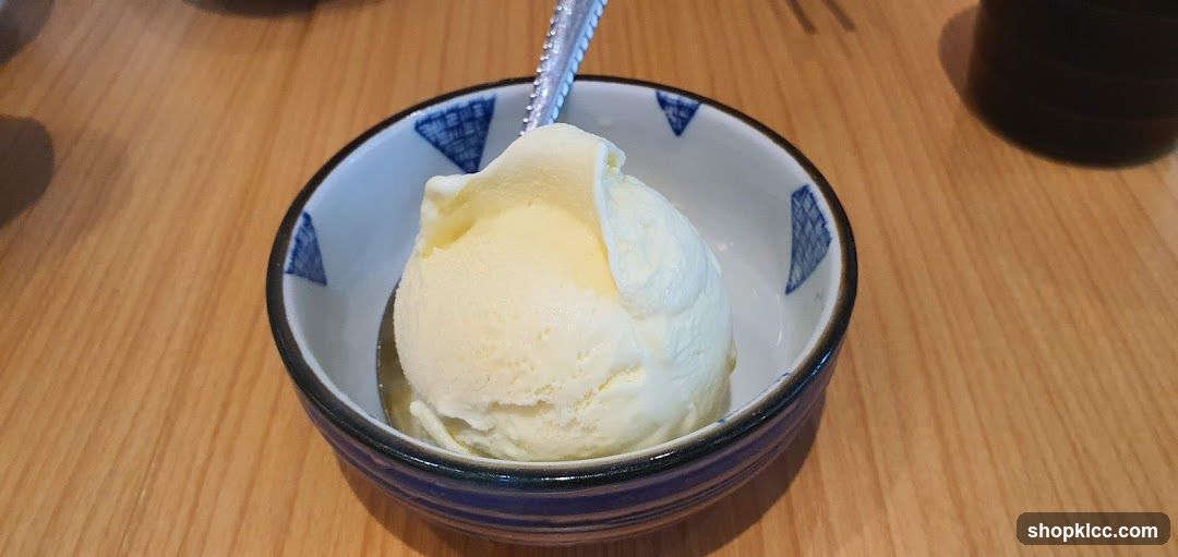 Scoop of Vanilla Ice Cream in a Small Bowl