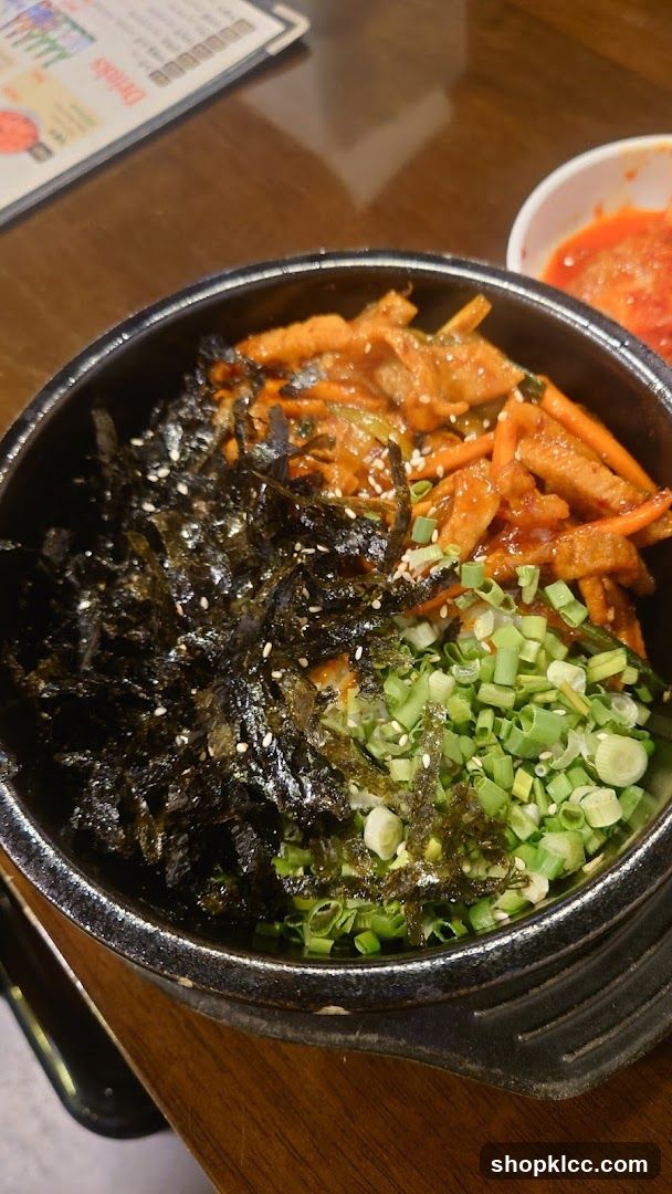 Bowl of Korean-style food with seaweed and vegetables