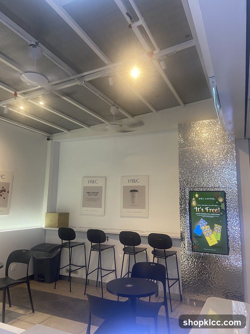Coffee shop interior with seating and promotional display