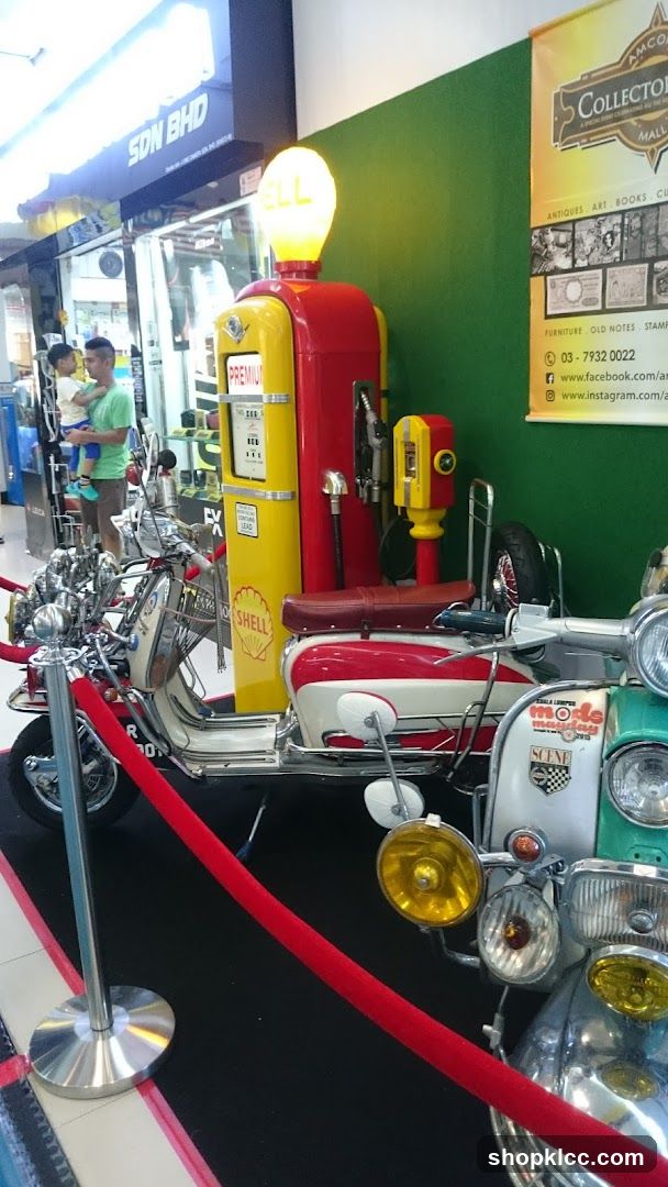 Vintage Motorcycle and Gas Pump Display