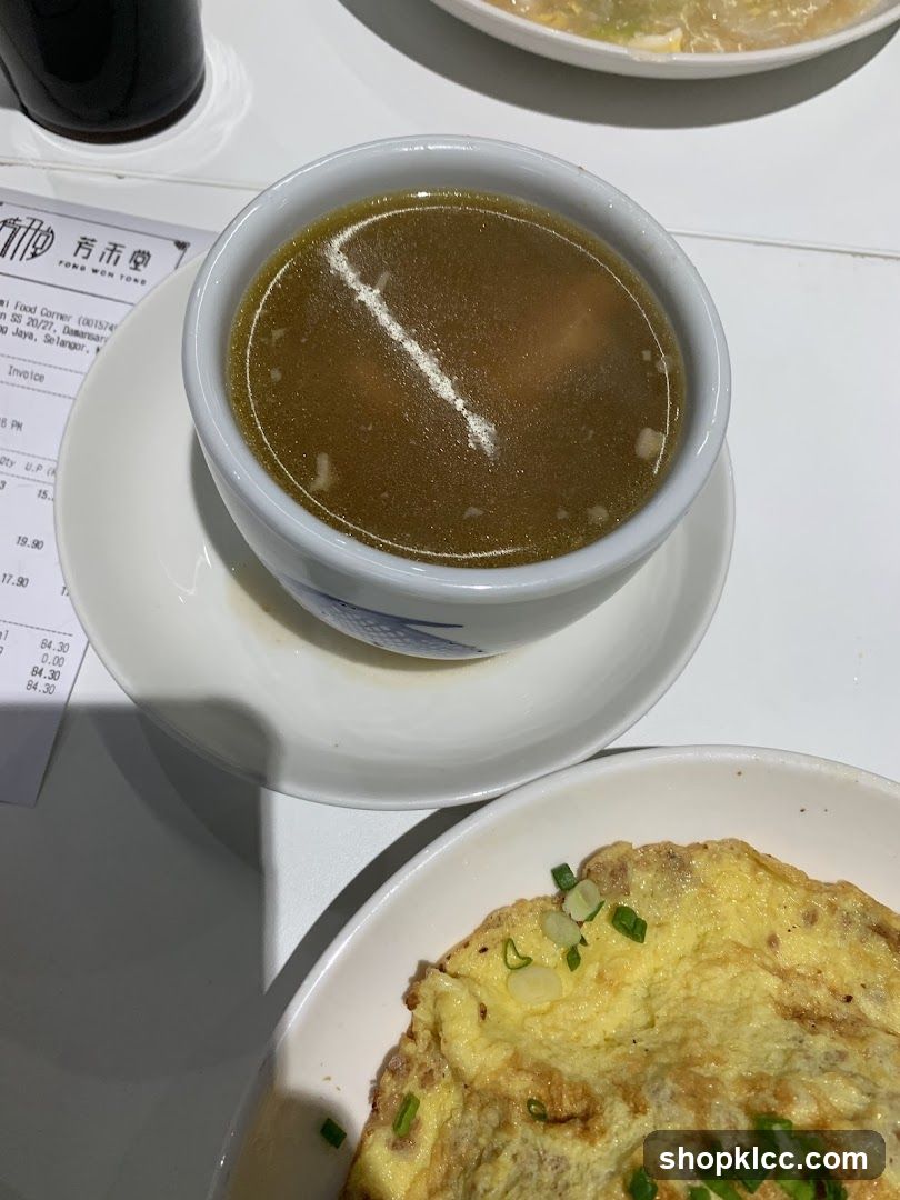 Dish with soup and omelette