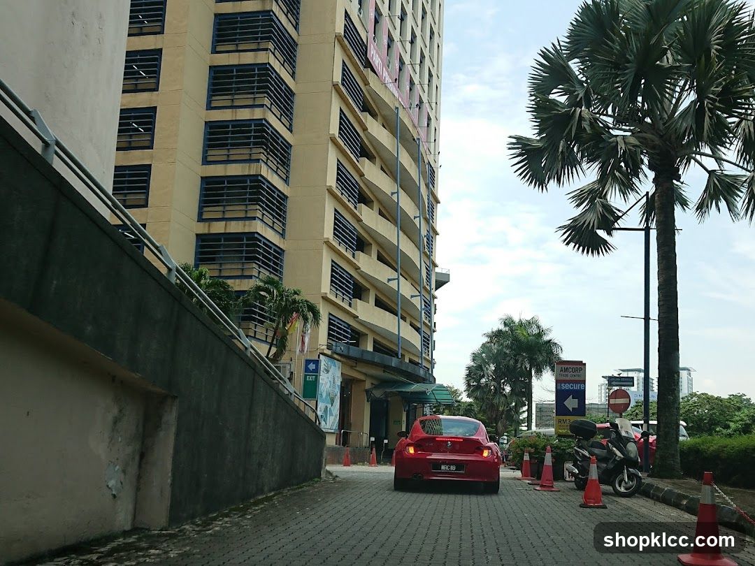 Street View with Red Car and Tall Building