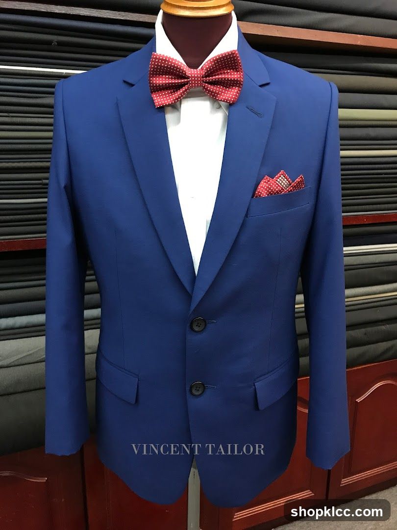 Blue Suit with Red Bowtie and Pocket Square