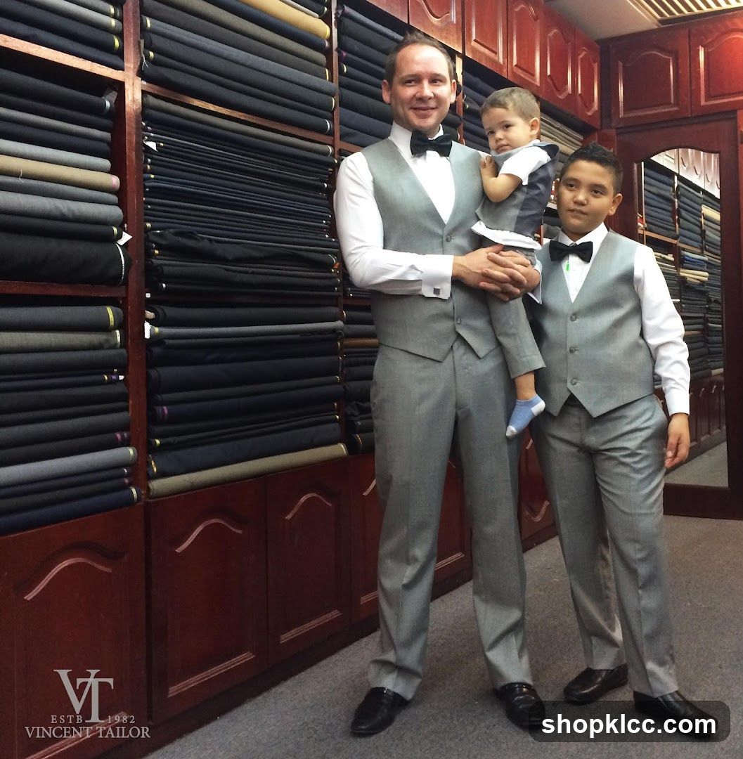 Three males in matching suits