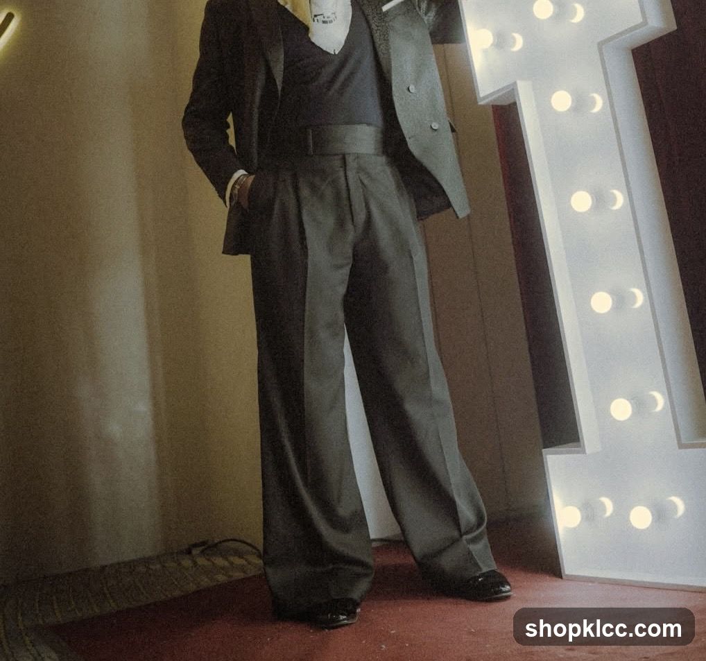 Man in Formal Attire with Marquee Letter