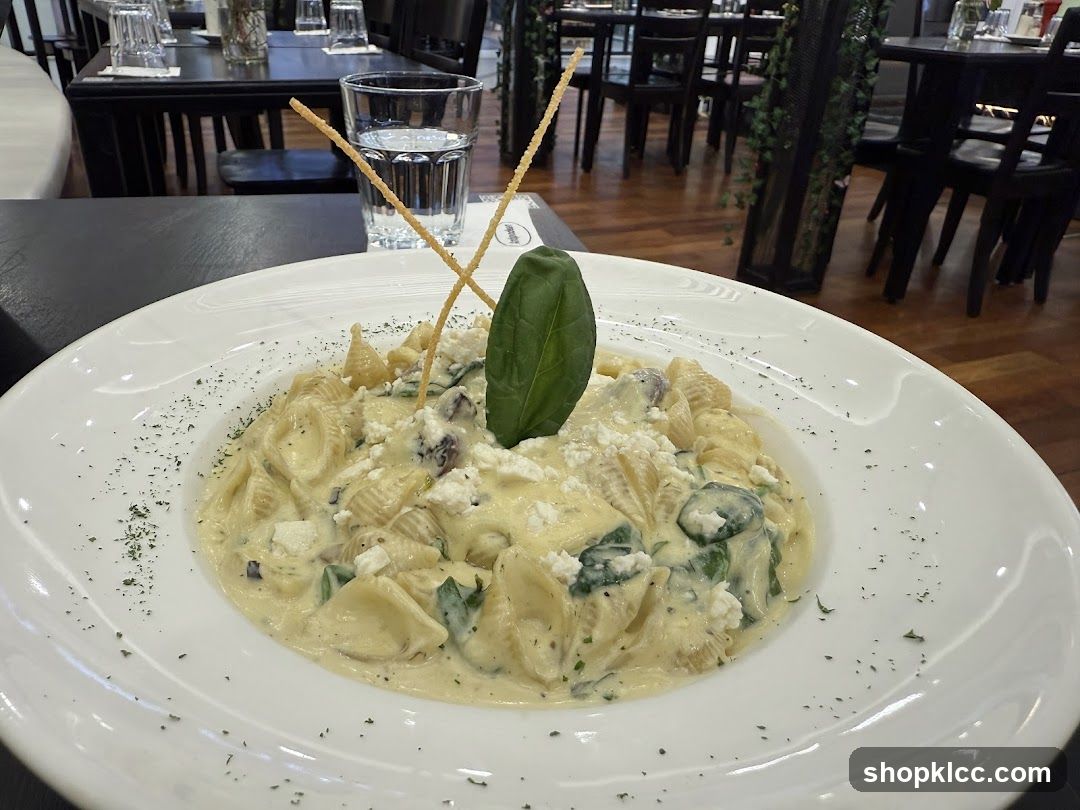 Pasta dish with cheese and spinach