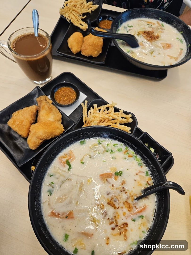 Two Bowls of Soup with Sides and a Drink