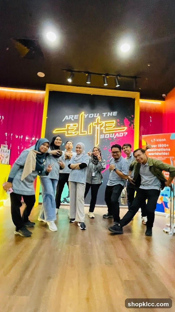 Group Posing in Front of a Neon Sign