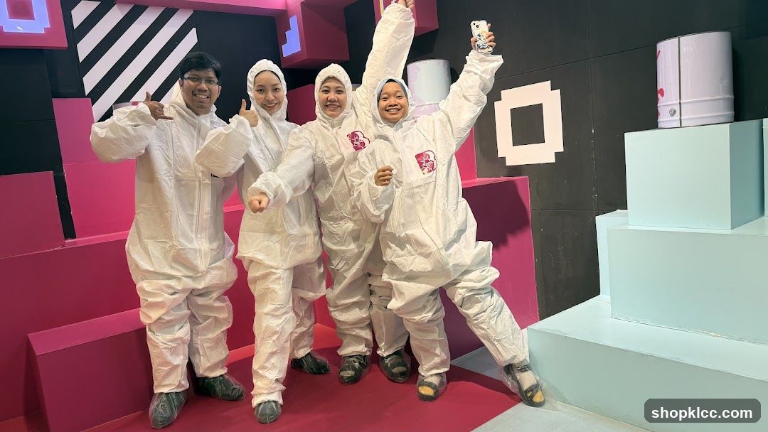 Group in protective suits posing for a photo