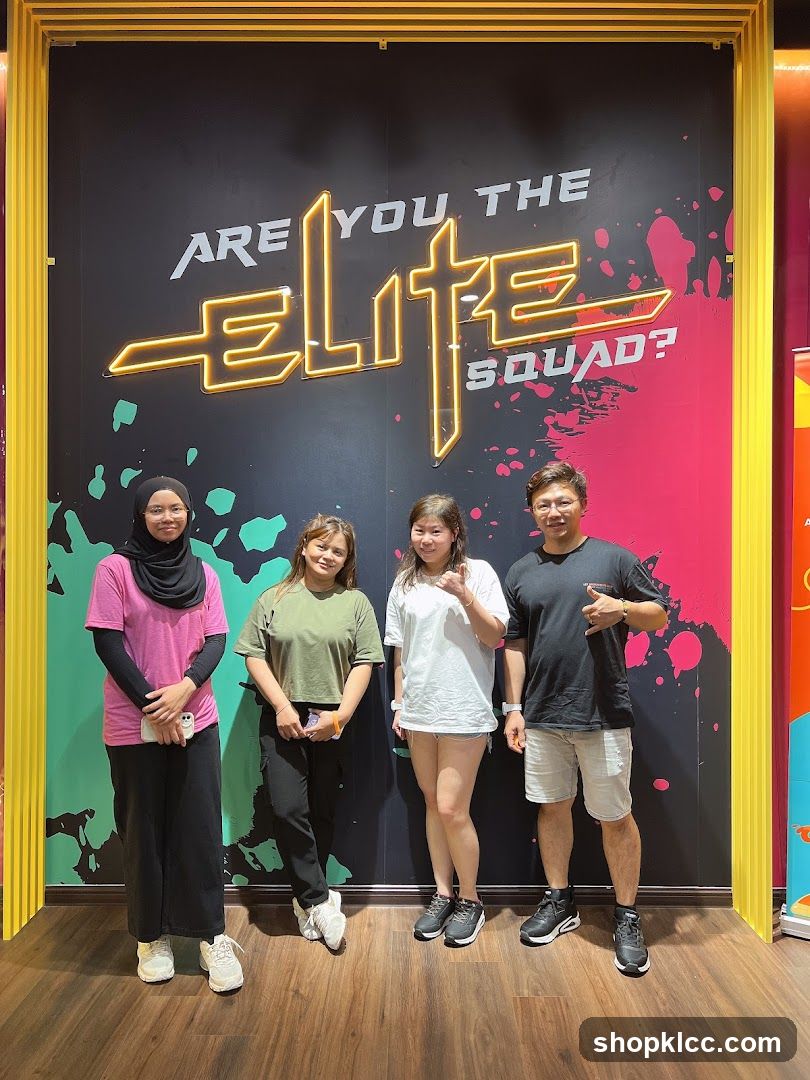 Group Posing in Front of Neon Sign