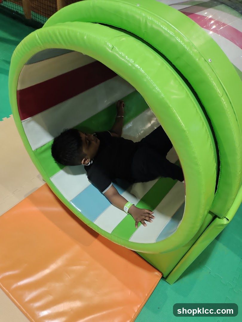 Child in a play tunnel