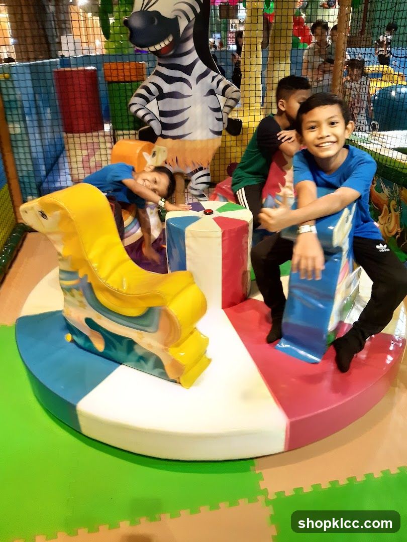 Children on a carousel in a play area