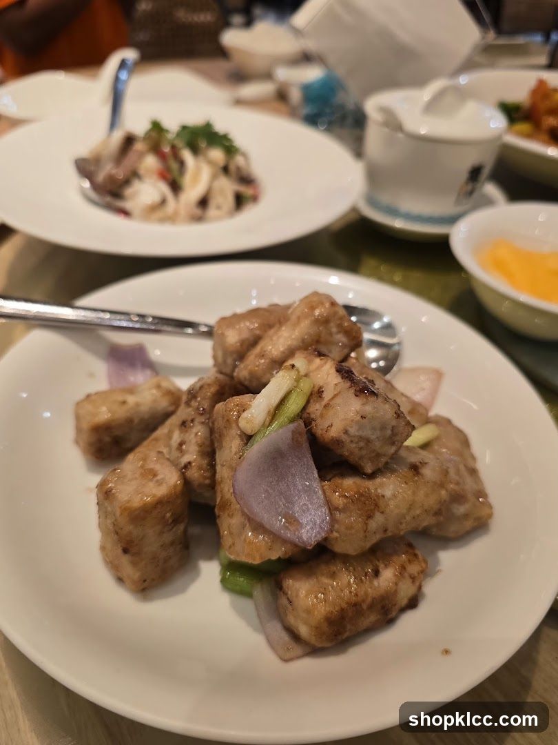 Dish of fried tofu with onions and green peppers
