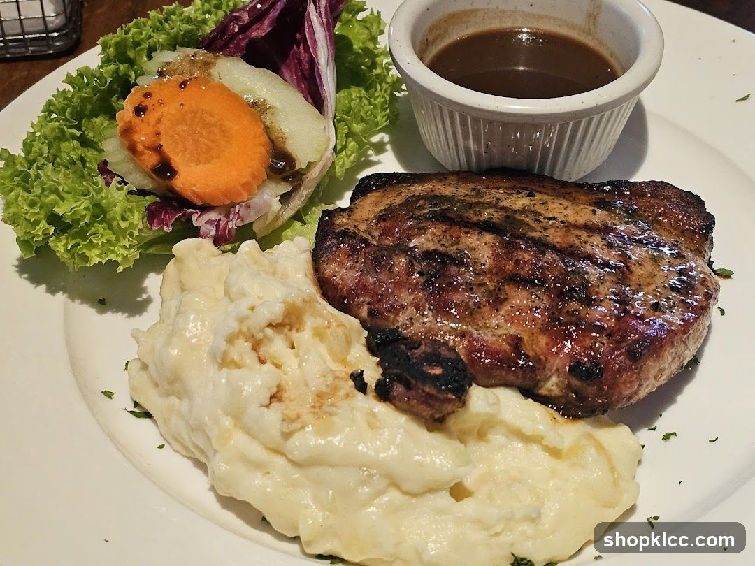 Grilled Pork Chop with Mashed Potatoes and Salad