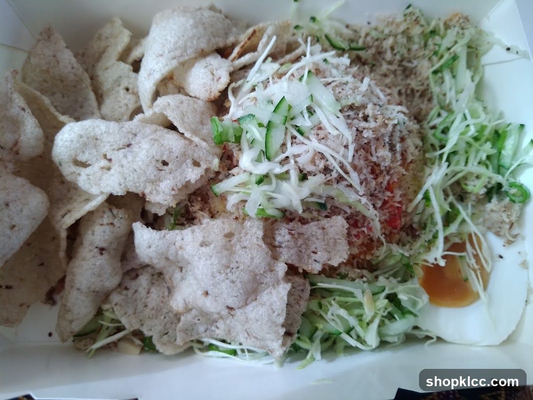 Food Container with Fried Chips and Salad