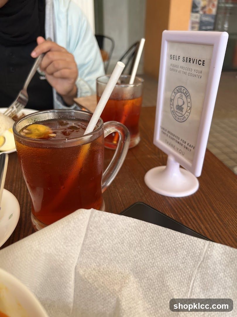 Dining Table with Iced Tea and Self Service Sign