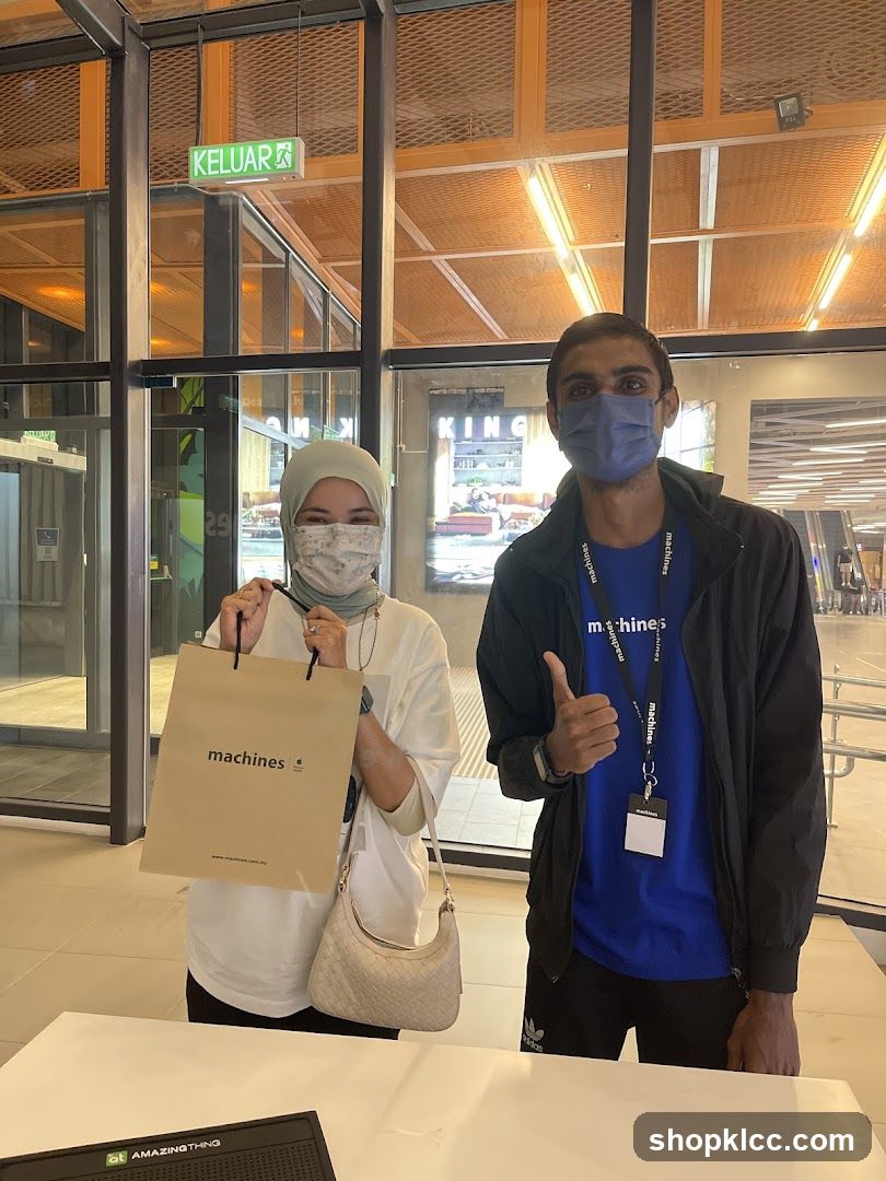 Staff with shopping bag at store entrance