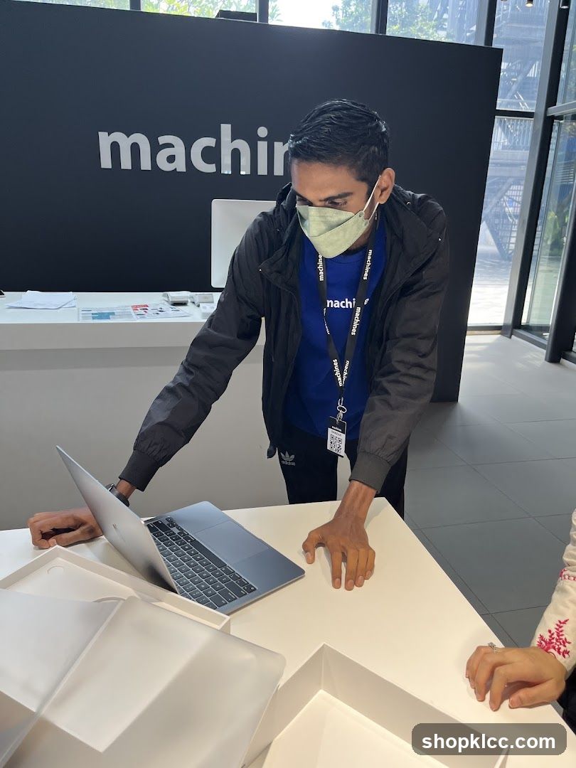 Staff with laptop at counter