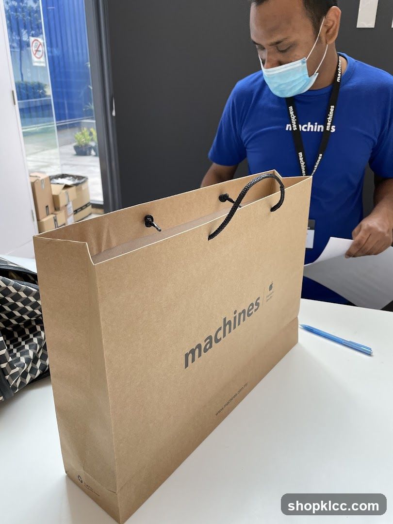 Staff with branded shopping bag