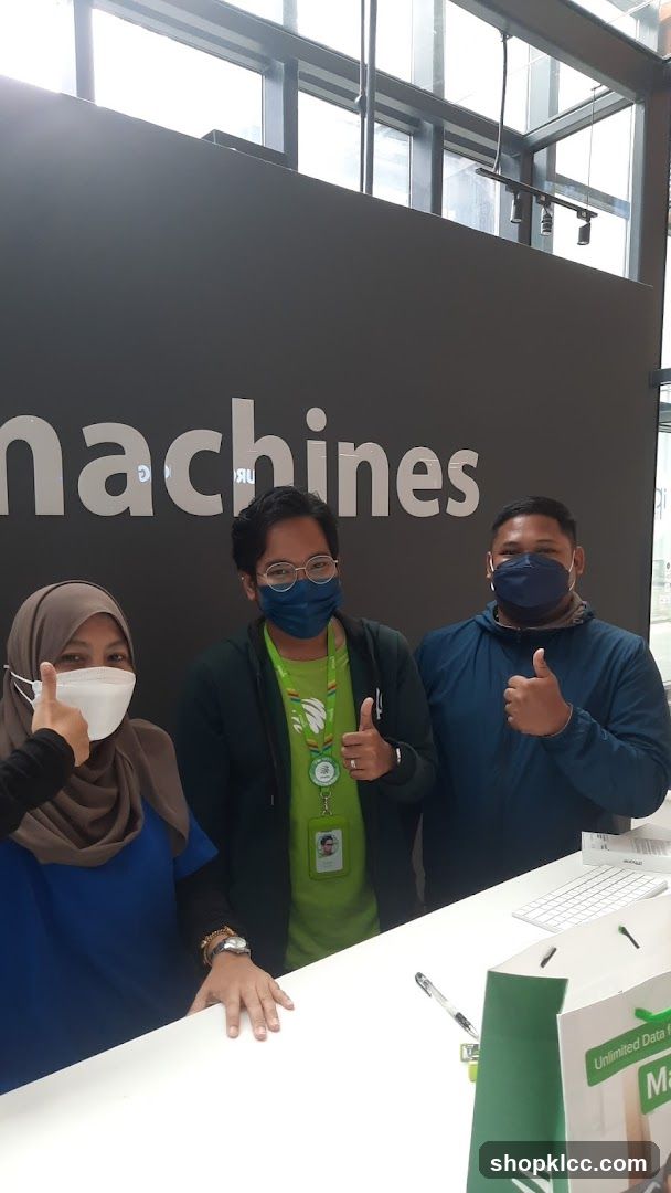 Staff with 'machines' sign