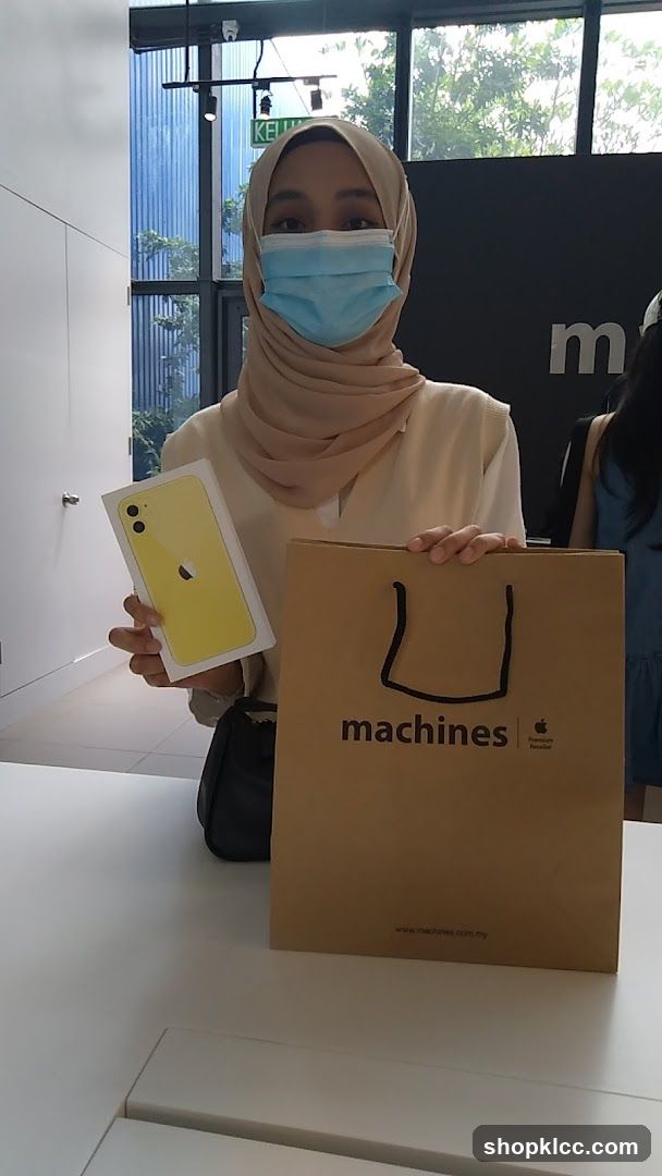 Person with iPhone and shopping bag